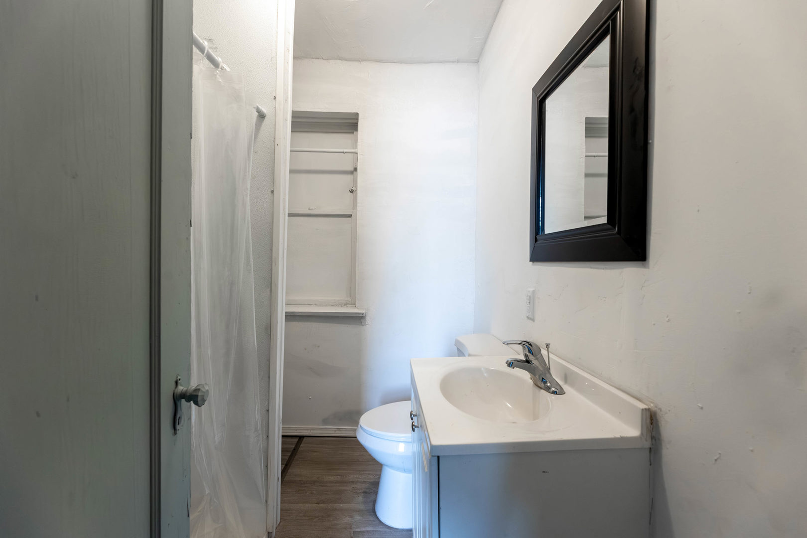 7316 South Racine Avenue Chicago, IL 60636 - Photo 9 of 15 a bathroom with a sink toilet and mirror