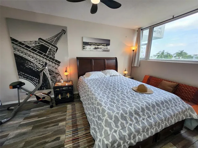 a bedroom with a bed and cabinets