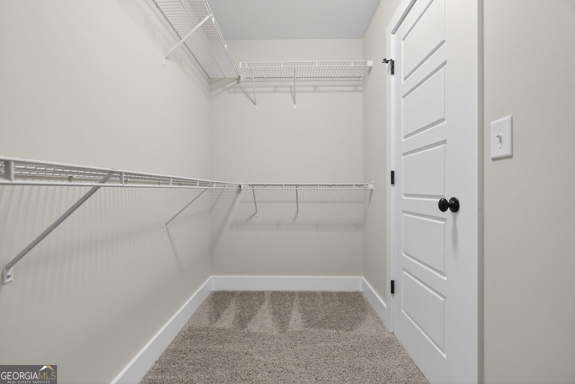 97 Wards Creek Road, Unit 1 Toccoa, GA 30577 - Photo 32 of 55 a view of walk in closet with empty racks