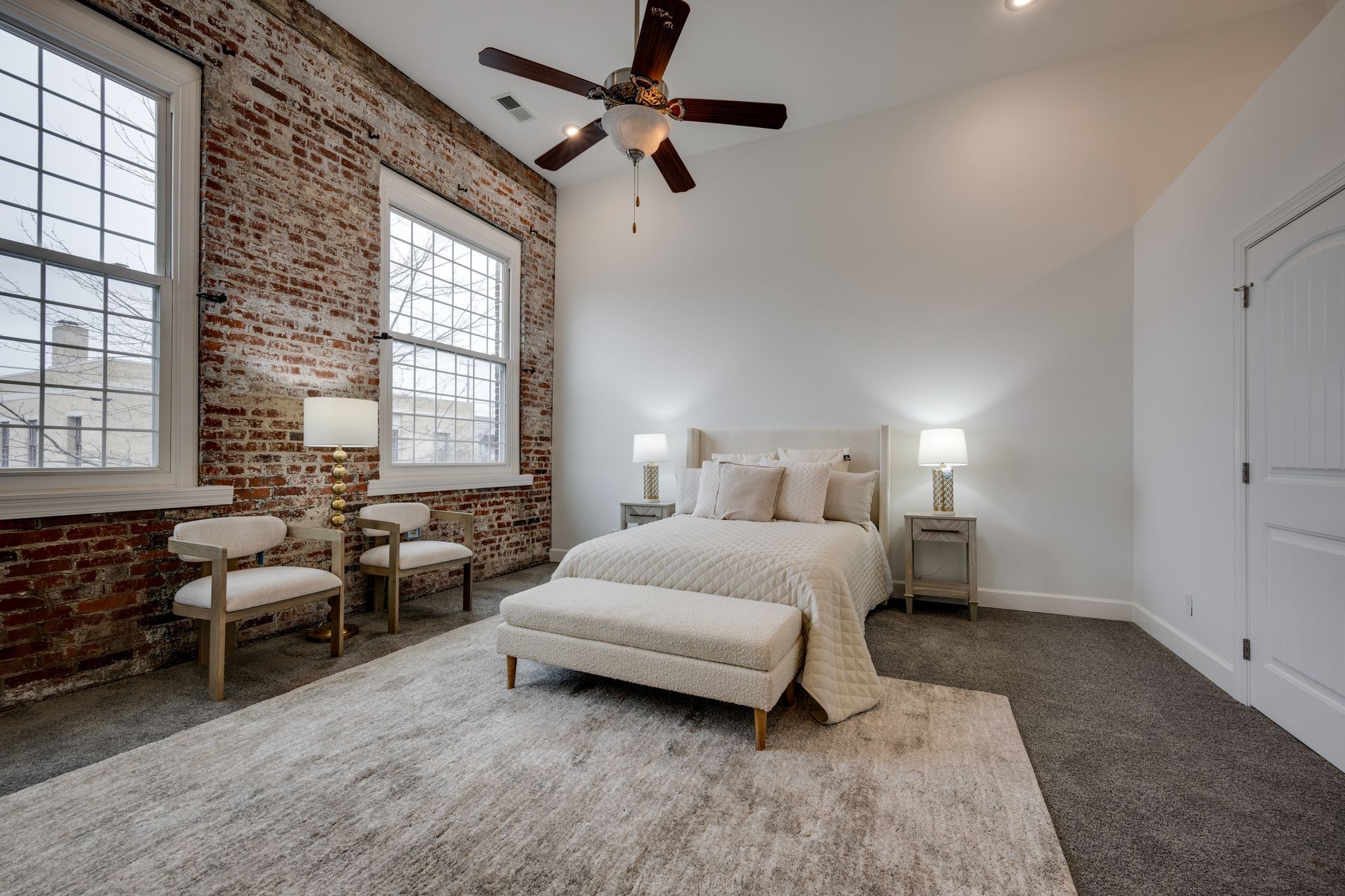 202 West College Street, Unit 4 Dickson, TN 37055 - Photo 19 of 40 a bedroom with a bed a couch and a window