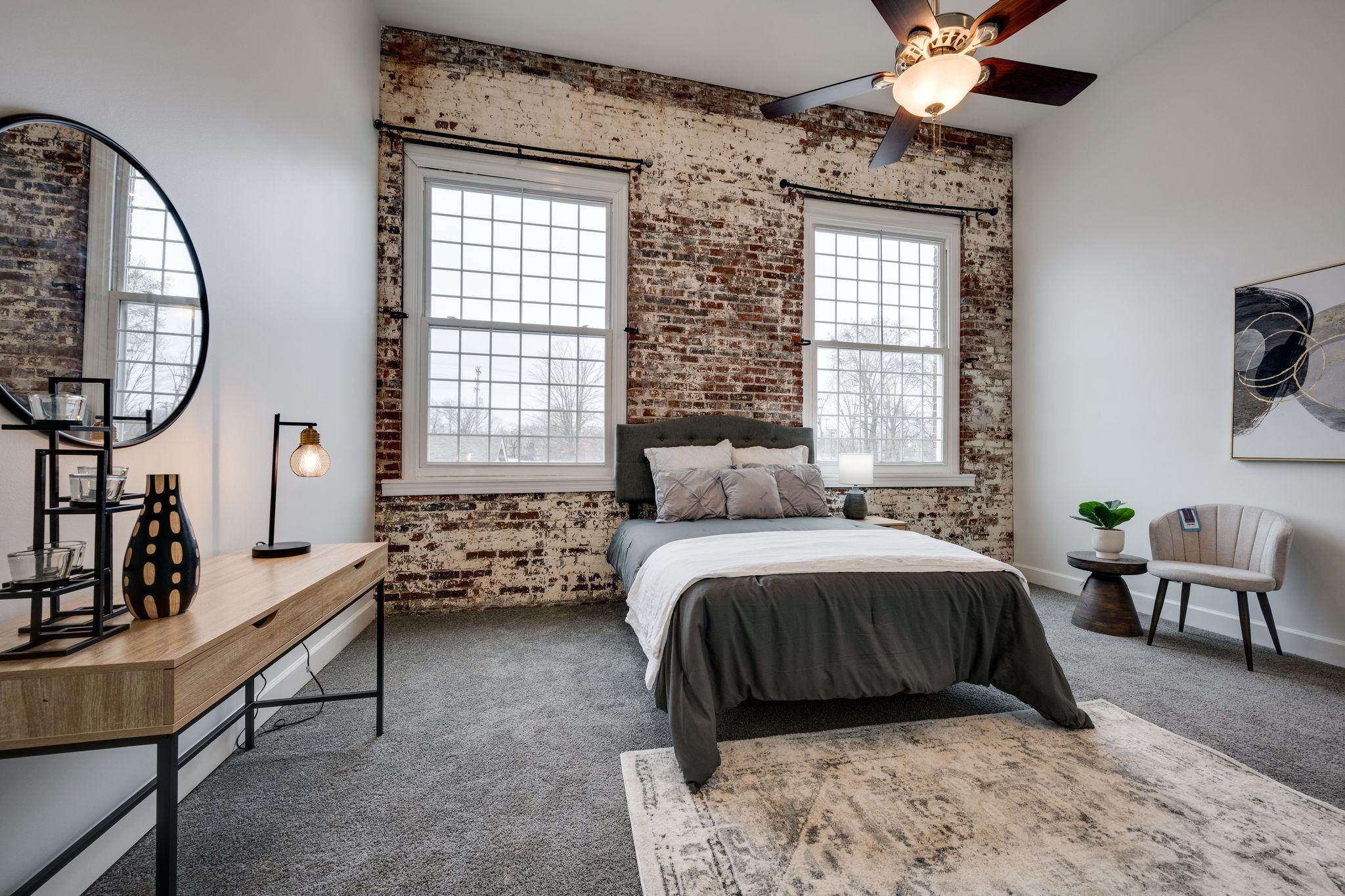 202 West College Street, Unit 4 Dickson, TN 37055 - Photo 23 of 40 a bedroom with a bed and a chandelier