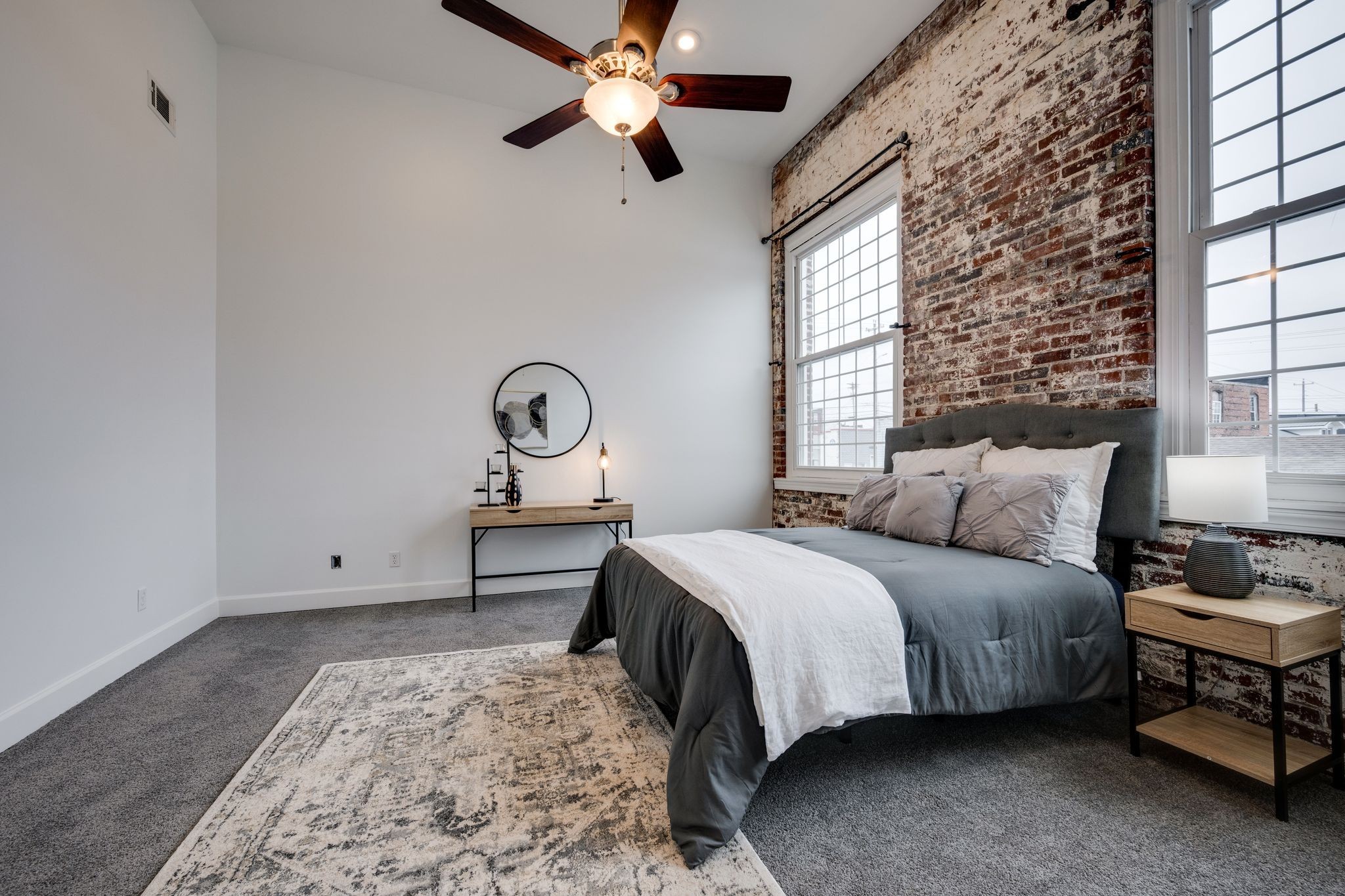 202 West College Street, Unit 4 Dickson, TN 37055 - Photo 24 of 40 a bedroom with a bed wooden floor and window