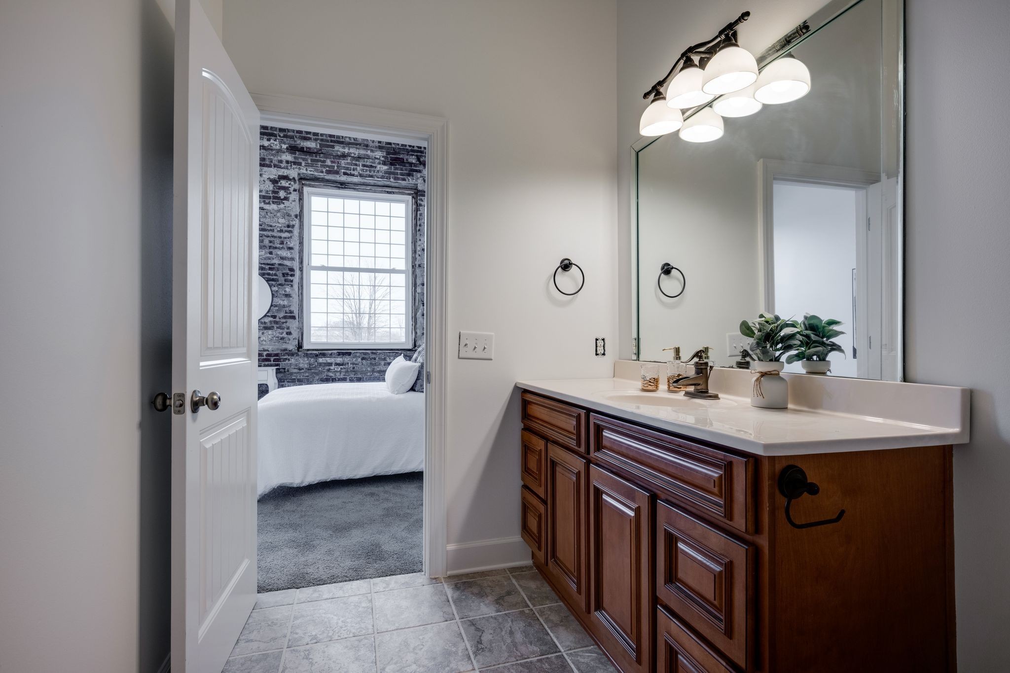 202 West College Street, Unit 4 Dickson, TN 37055 - Photo 34 of 40 a bathroom with a tub sink and mirror