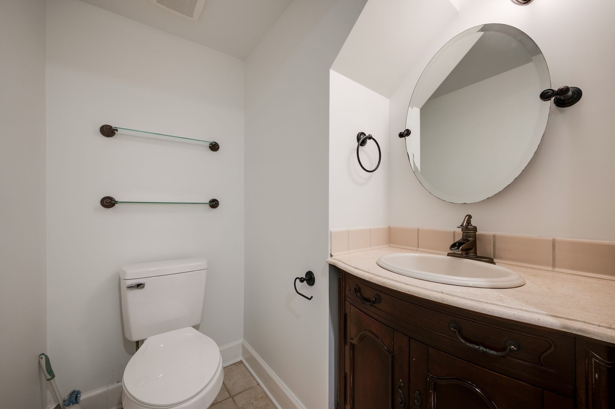 202 West College Street, Unit 4 Dickson, TN 37055 - Photo 35 of 40 a bathroom with a sink a toilet and a mirror