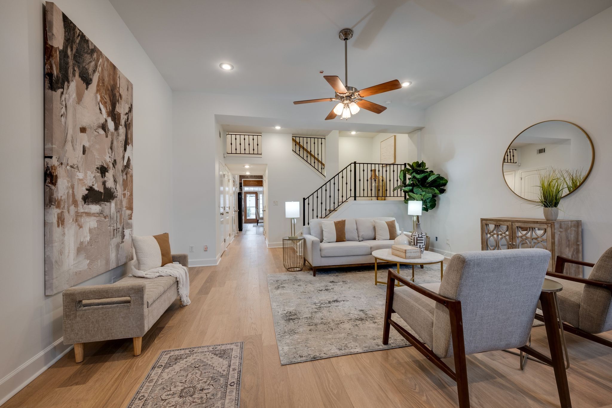 202 West College Street, Unit 4 Dickson, TN 37055 - Photo 8 of 40 a living room with furniture a rug and a chandelier