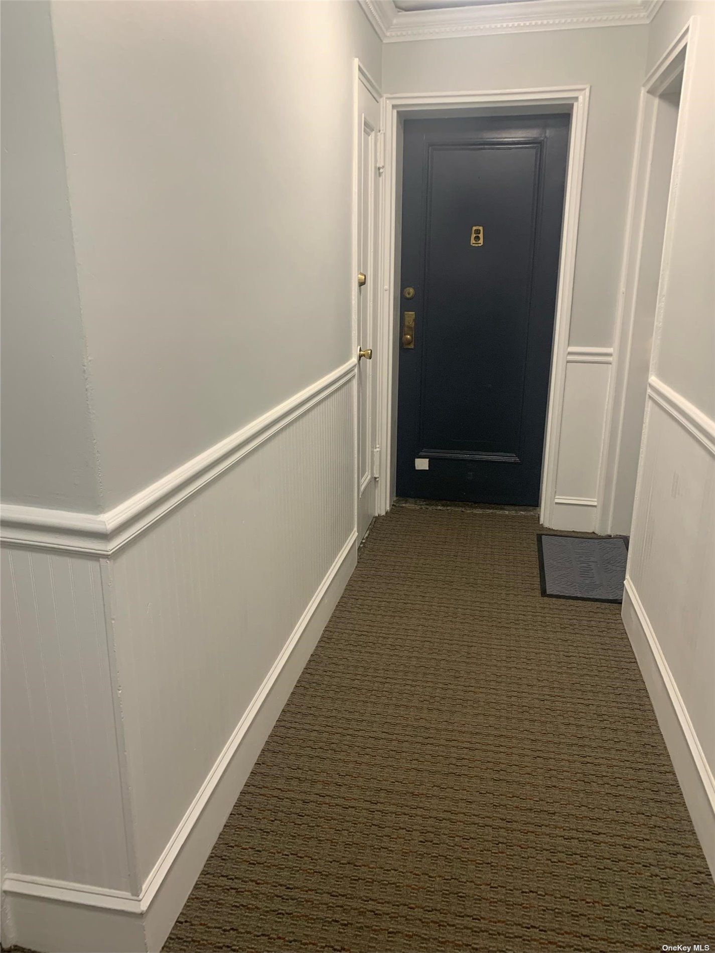 a view of hallway with closet