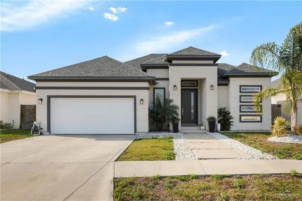 a front view of a house with yard