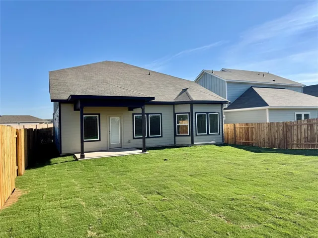 a house with yard in front of it