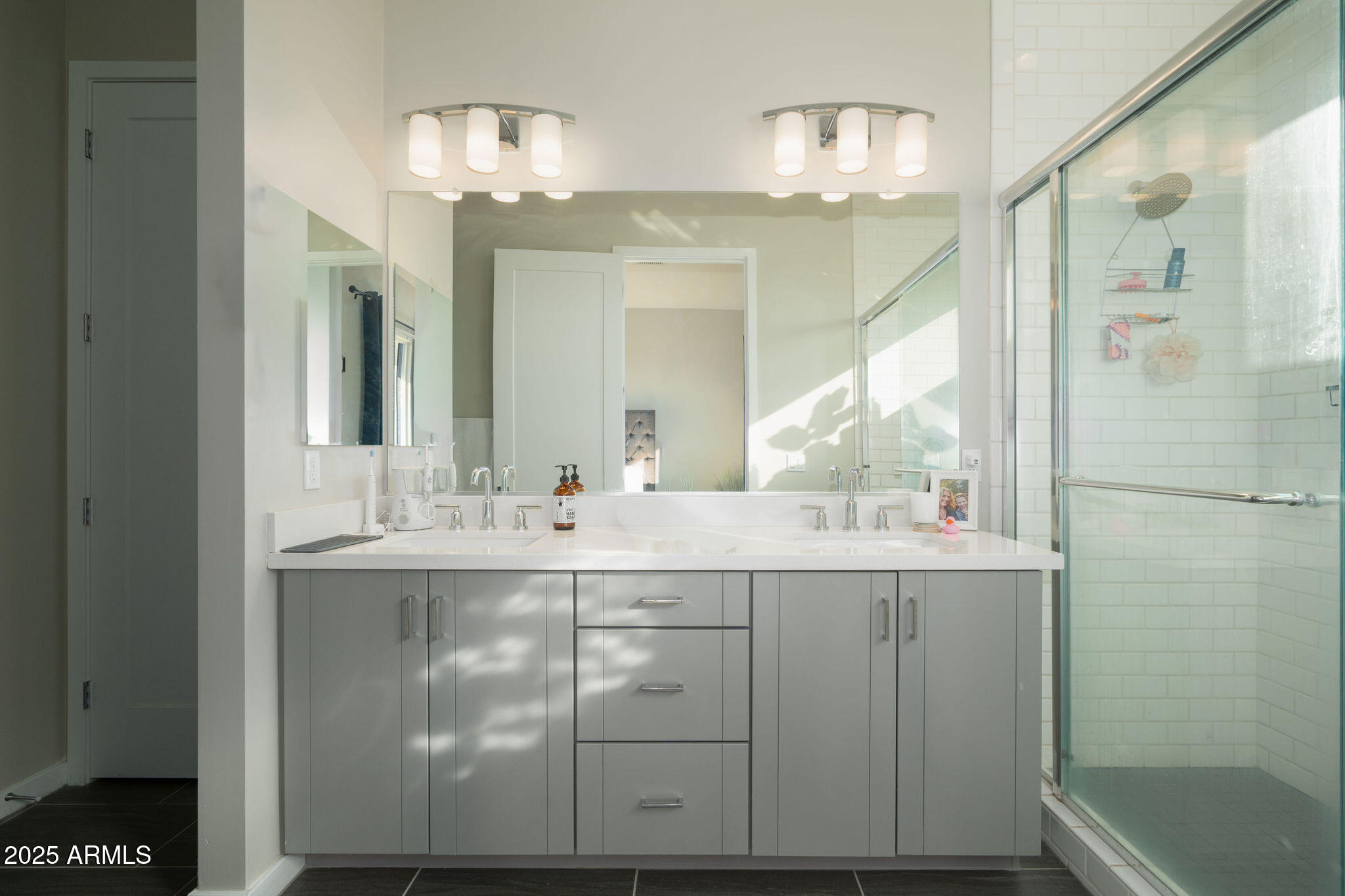 6301 North 12th Street, Unit 6 Phoenix, AZ 85014 - Photo 12 of 18 a bathroom with a sink and a mirror