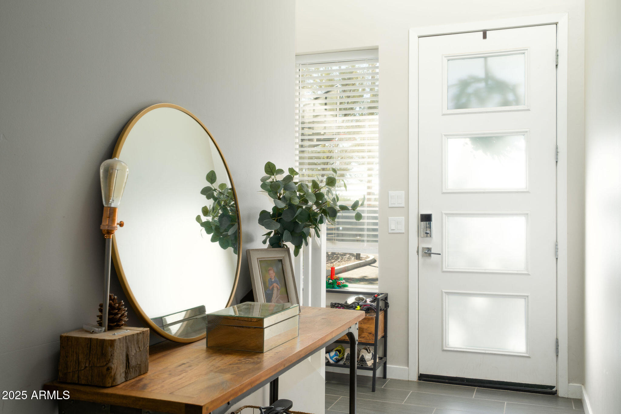 6301 North 12th Street, Unit 6 Phoenix, AZ 85014 - Photo 2 of 18 a view of a workspace with furniture and a window