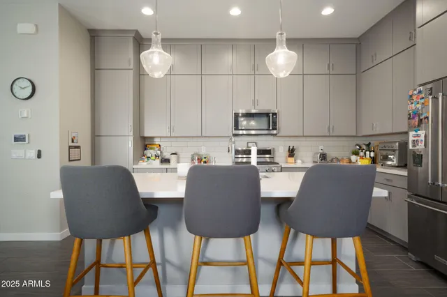 a view of kitchen and dining area with furniture