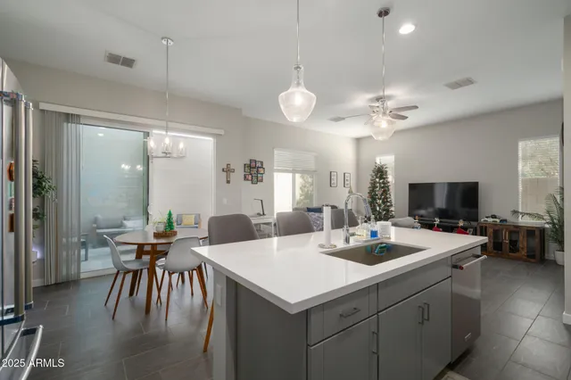 a kitchen with a stove a table and chairs