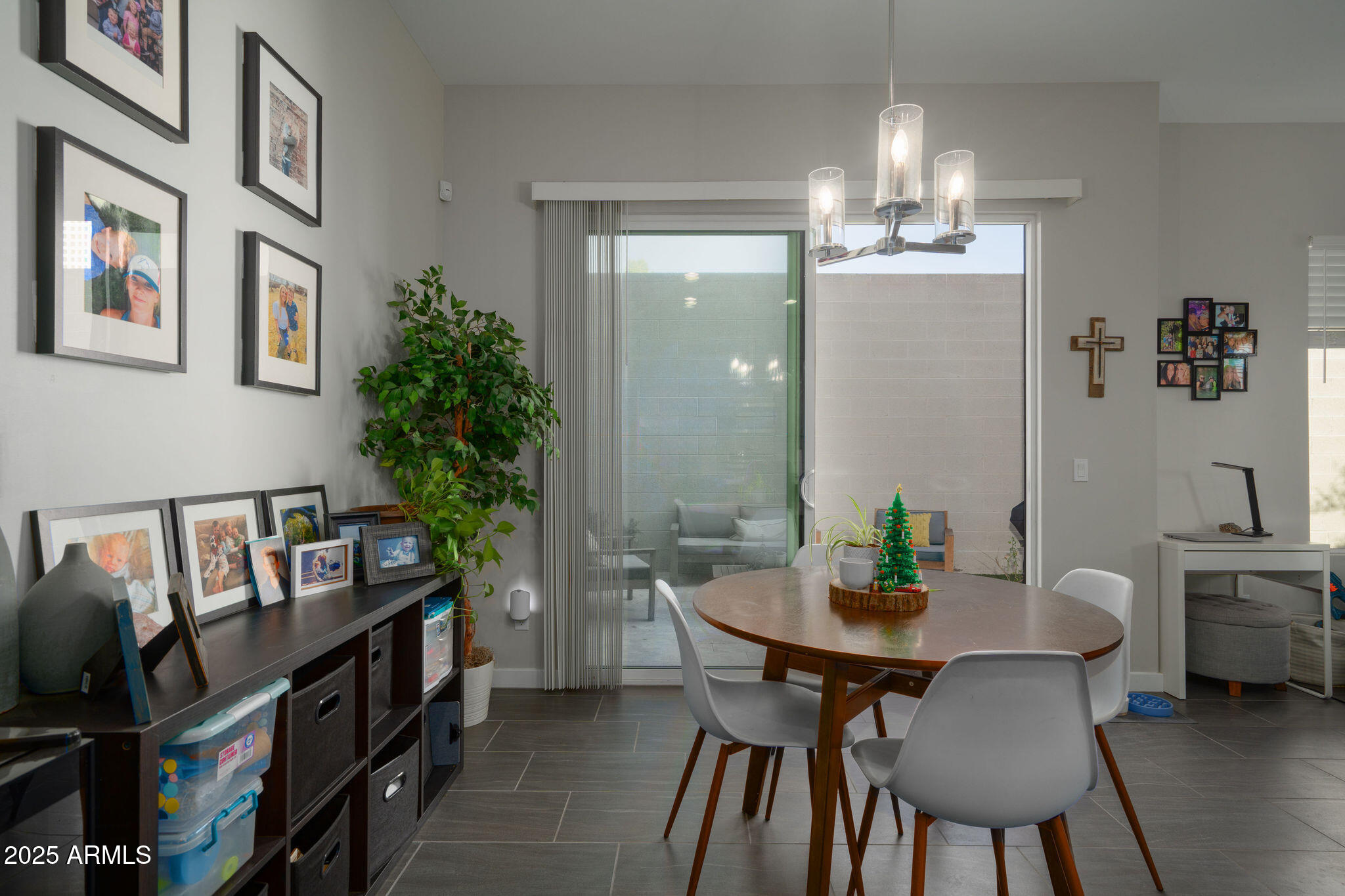 6301 North 12th Street, Unit 6 Phoenix, AZ 85014 - Photo 7 of 18 a view of a dining room with furniture and a chandelier