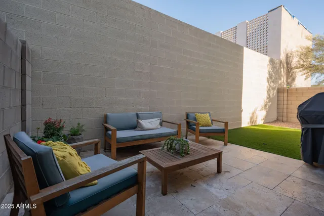 a outdoor living space with furniture and a garden