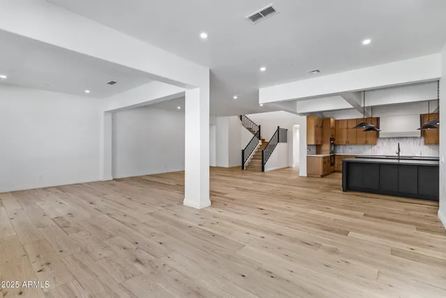 a kitchen with a sink and a refrigerator