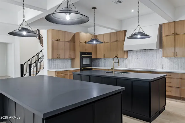 a bathroom with a sink a mirror and vanity