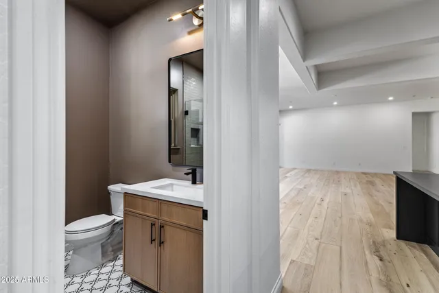 a view of a room with wooden floor and cabinet