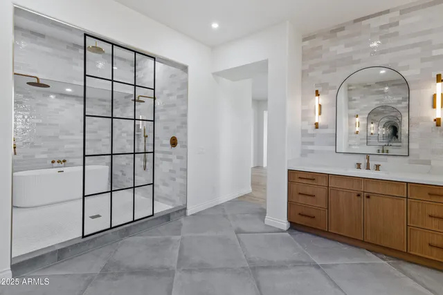 a bathroom with a double vanity sink toilet and a mirror