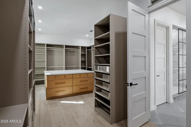 a front view of a house with a garden and yard