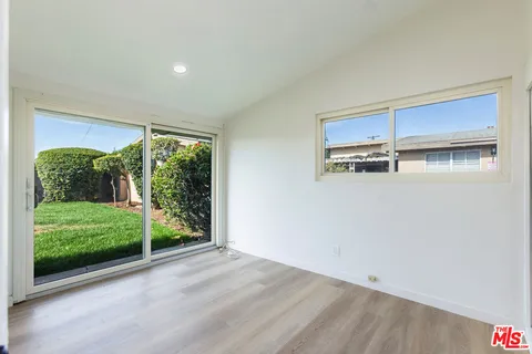 a view of a back yard from a room