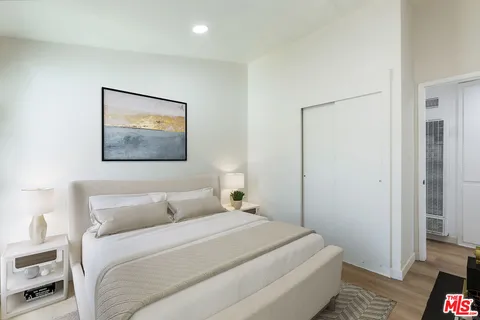 a bedroom with a bed and a view of bathroom