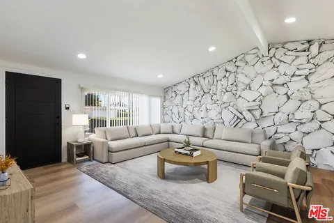 a living room with furniture and a couch