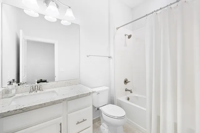 a view of a house with swimming pool and sitting area