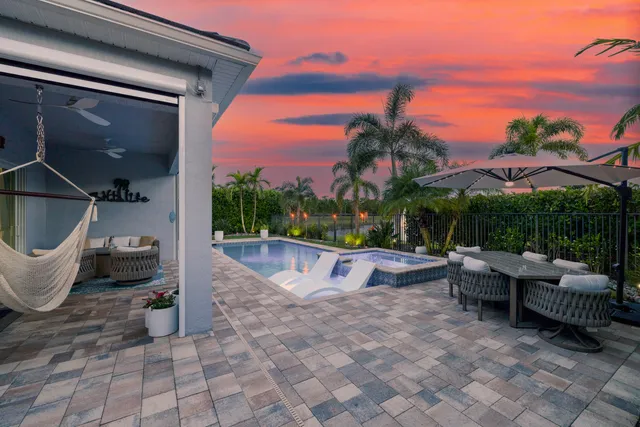 an aerial view of residential houses with outdoor space and street view