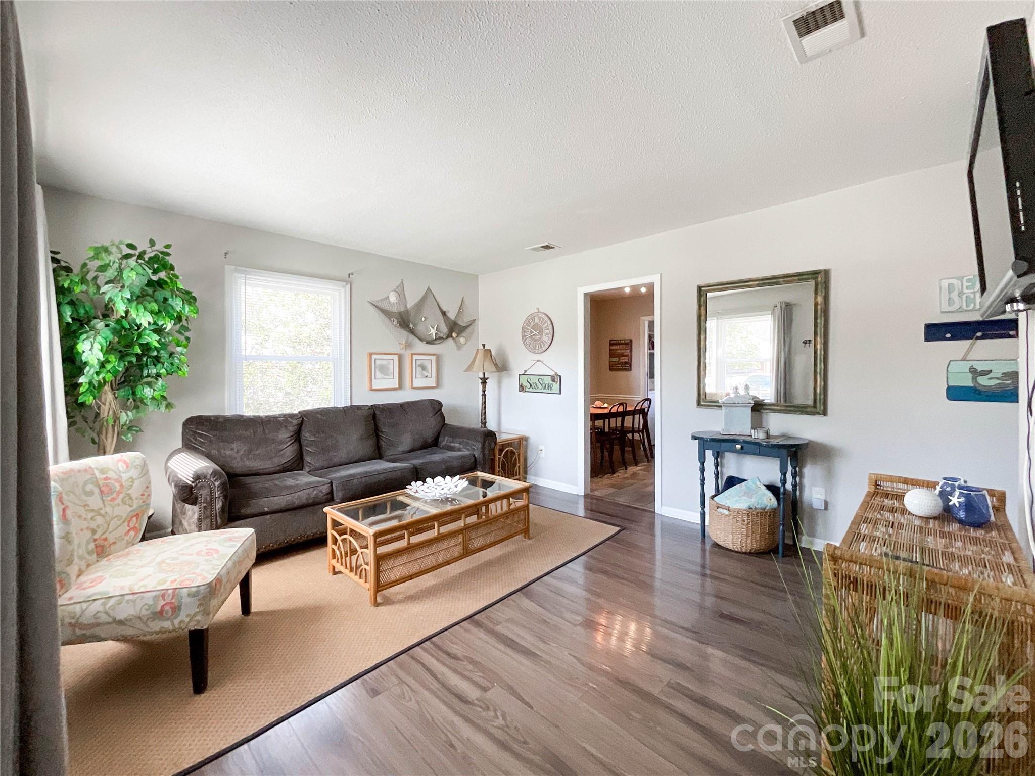 8004 Idlewild Road Indian Trail, NC 28079 - Photo 15 of 33 a living room with furniture and a wooden floor
