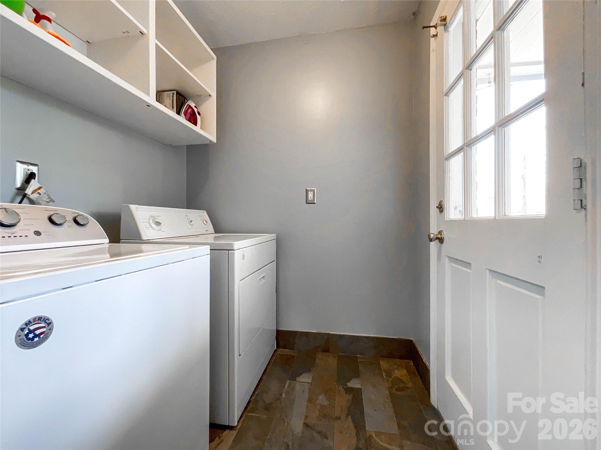 8004 Idlewild Road Indian Trail, NC 28079 - Photo 18 of 33 a utility room with dryer and washer