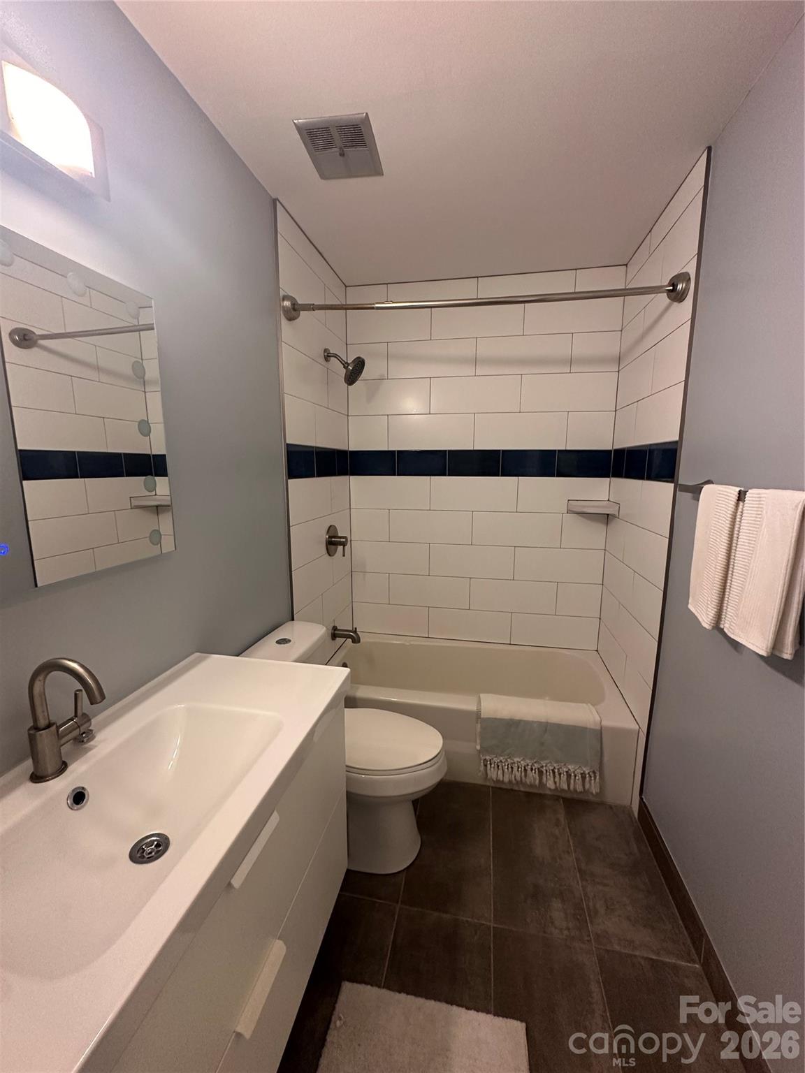 8004 Idlewild Road Indian Trail, NC 28079 - Photo 20 of 33 a bathroom with a sink a toilet and shower