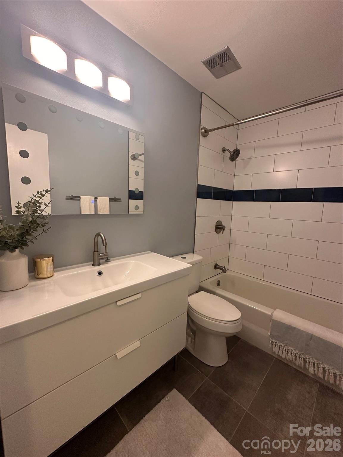 8004 Idlewild Road Indian Trail, NC 28079 - Photo 21 of 33 a bathroom with a sink a toilet and shower