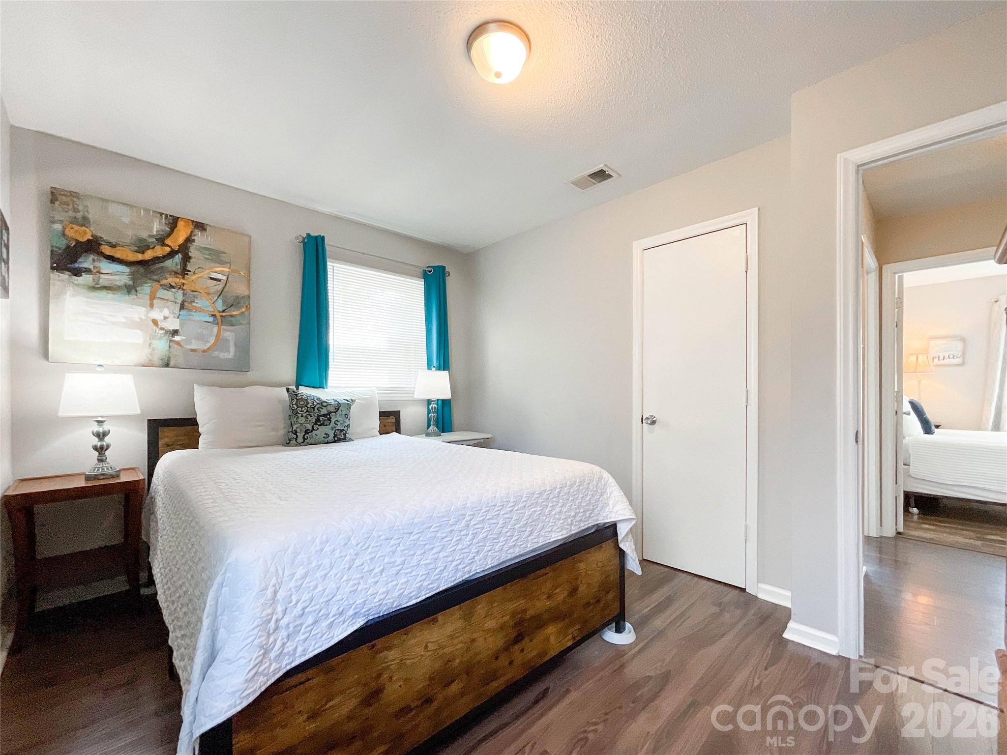 8004 Idlewild Road Indian Trail, NC 28079 - Photo 22 of 33 a bedroom with a bed and a view of kitchen