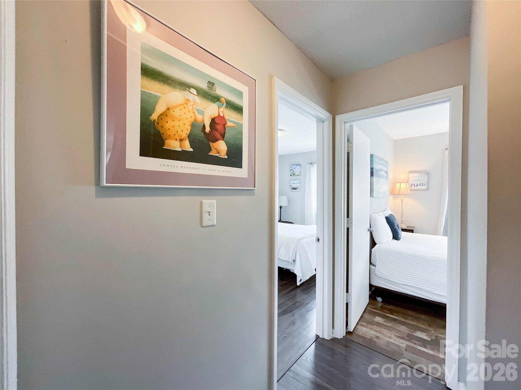8004 Idlewild Road Indian Trail, NC 28079 - Photo 25 of 33 a view of a bedroom with bed and wooden floor