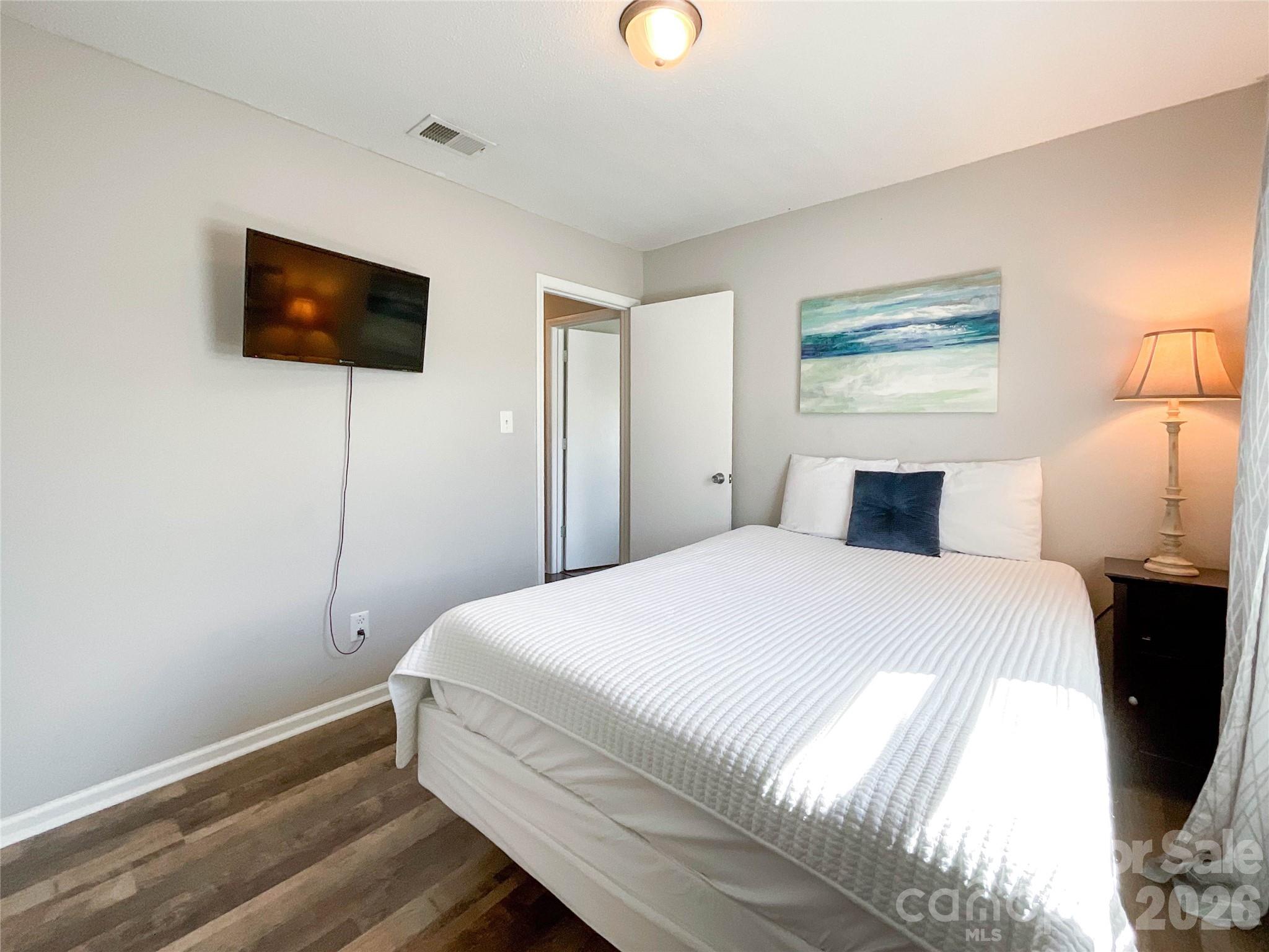 8004 Idlewild Road Indian Trail, NC 28079 - Photo 30 of 33 a bedroom with a bed and a flat screen tv