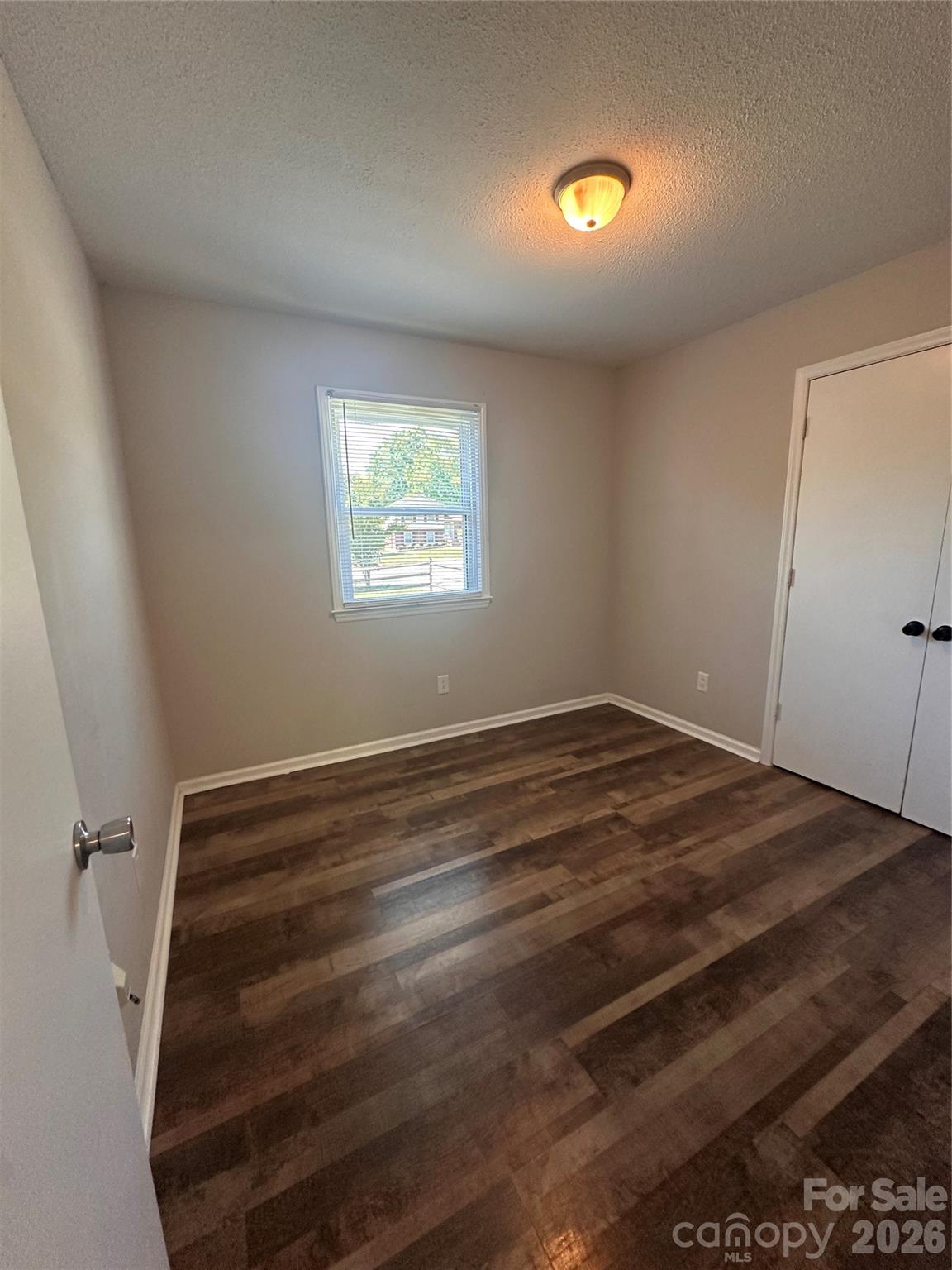 8004 Idlewild Road Indian Trail, NC 28079 - Photo 33 of 33 a view of a room with wooden floor and window