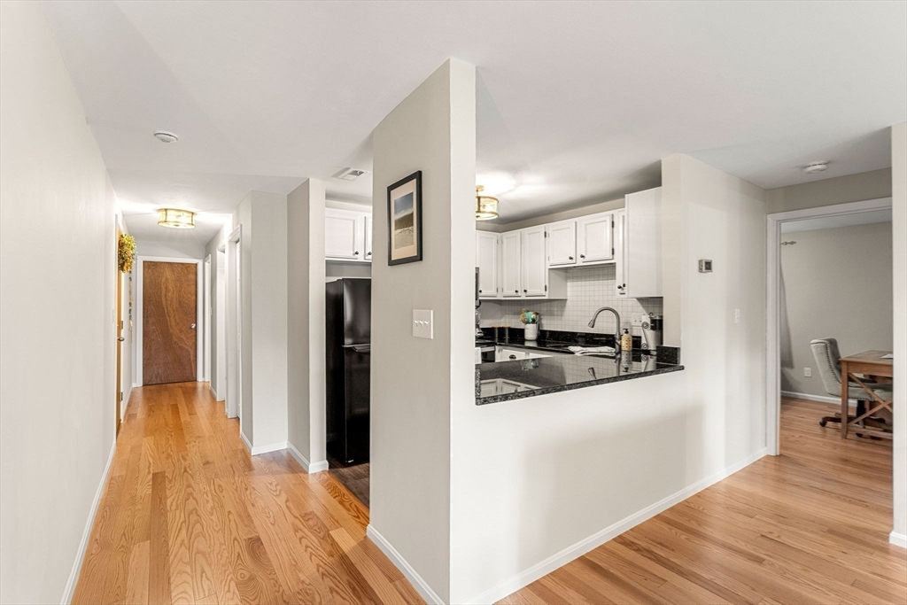 30 Conant Street, Unit 2D Beverly, MA 01915 - Photo 7 of 17 a view of a kitchen from the hallway
