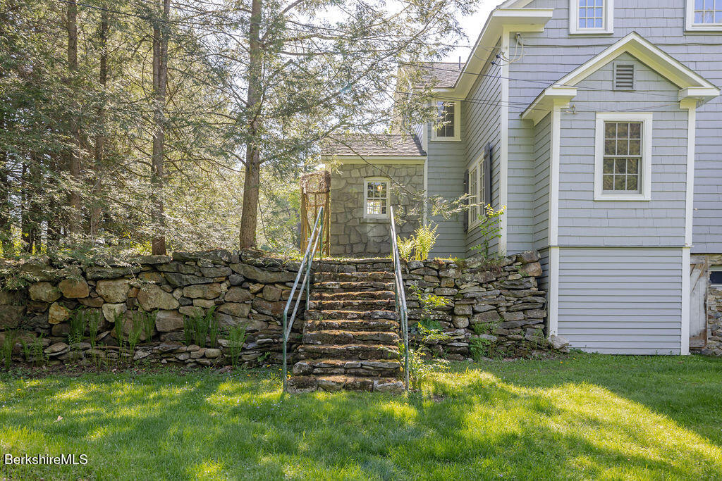 17 Cronk Road Monterey, MA 01245 - Photo 66 of 79 a view of a brick house with a yard