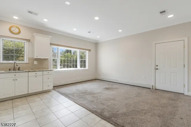 a view of a kitchen with windows