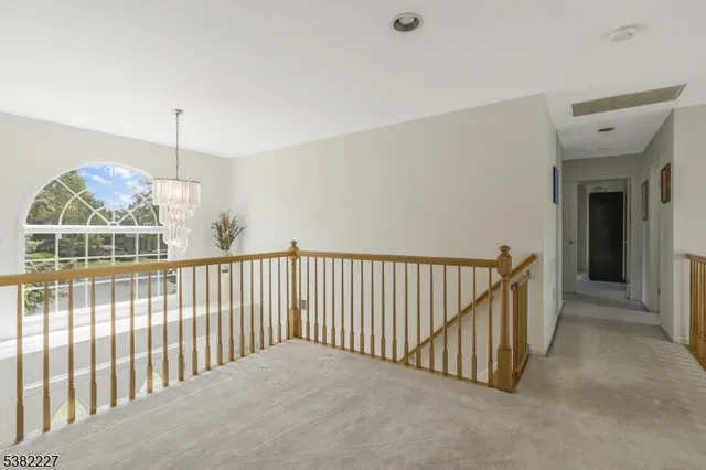 a view of a hallway with windows