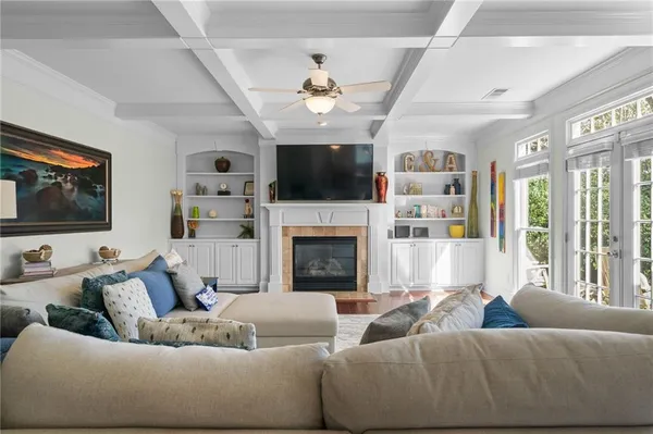a view of a dining room with furniture wooden floor and chandelier