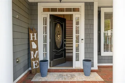 a kitchen with granite countertop a sink stainless steel appliances and cabinets