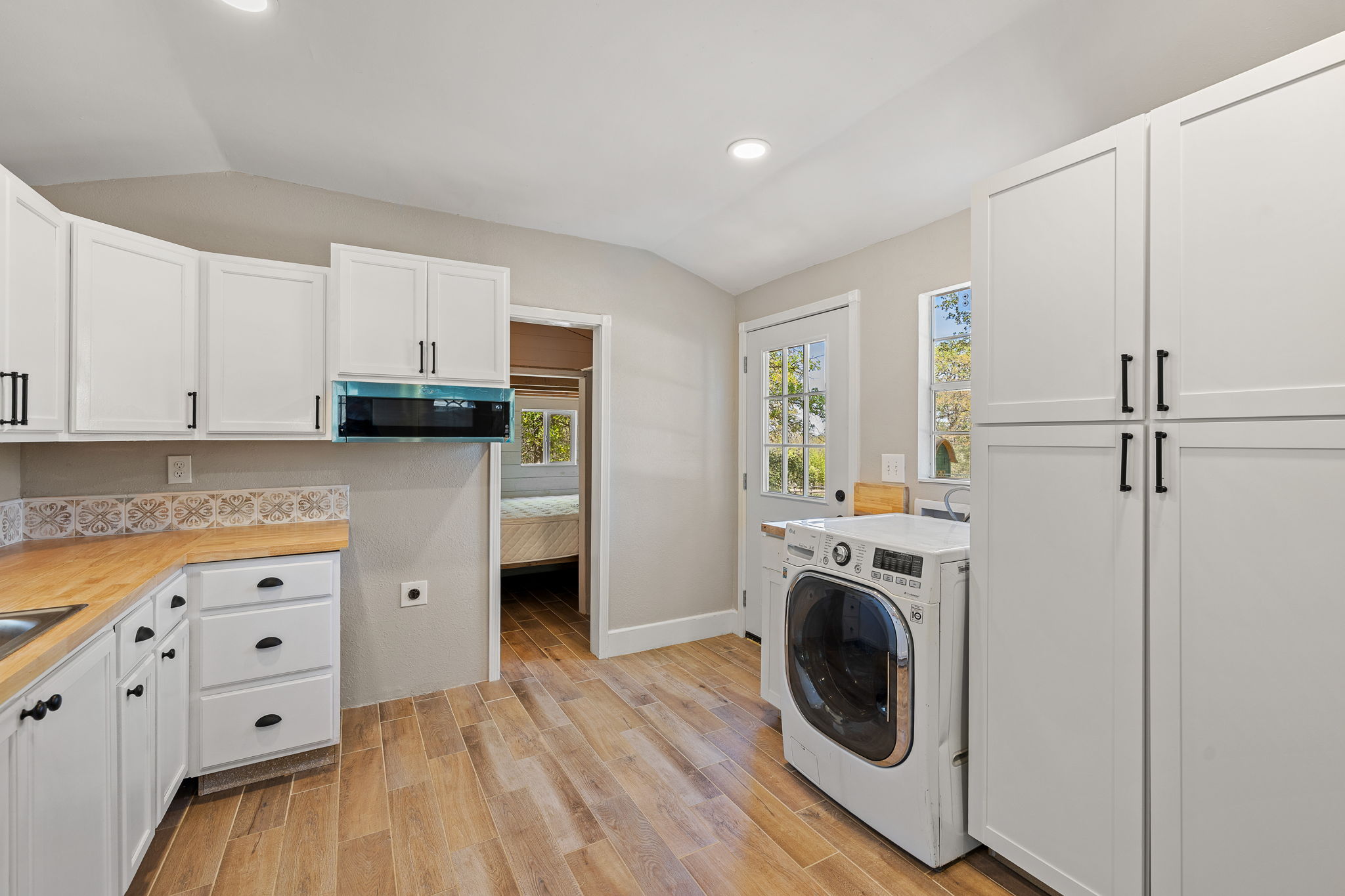541 Hidden Oaks Drive Elgin, TX 78621 - Photo 30 of 40 The TINY HOME includes its own laundry space and STORAGE!