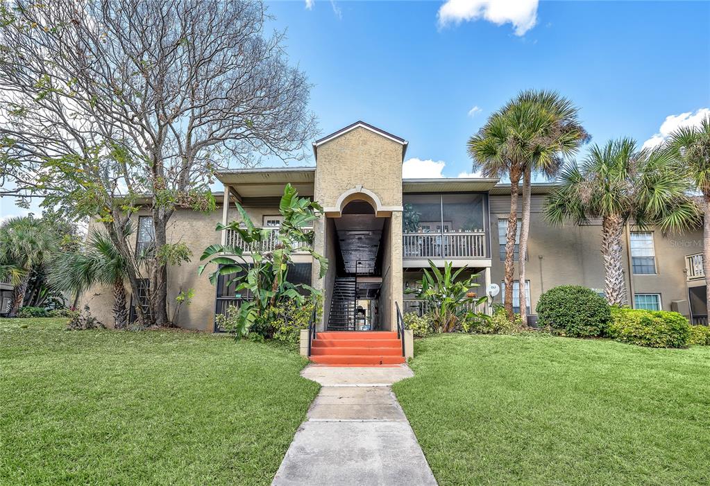 395 Wymore Road, Unit 101 Altamonte Springs, FL 32714 - Photo 1 of 1 a front view of a house with garden