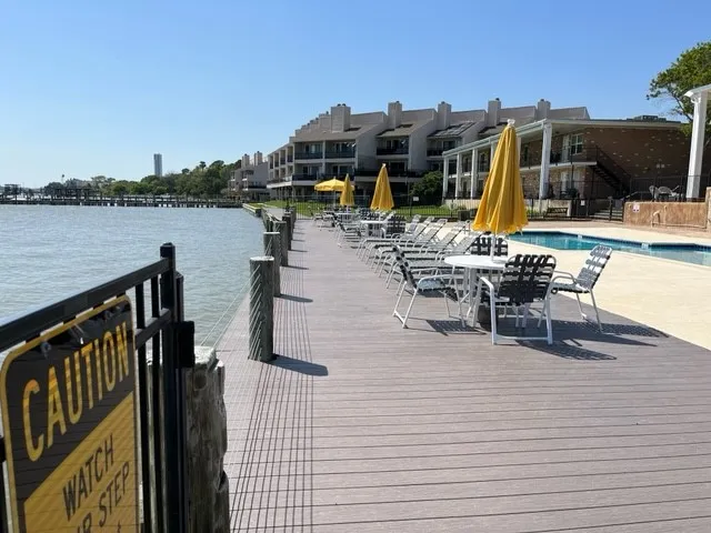 a view of a lake with a table and chairs