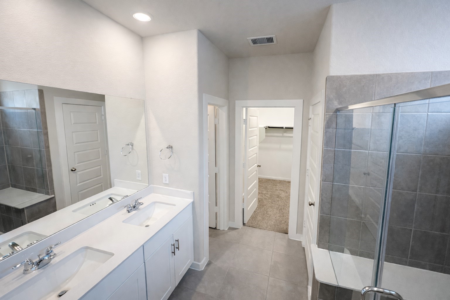 5715 Madden Lane Houston, TX 77048 - Photo 7 of 16 a bathroom with a double vanity sink mirror and shower