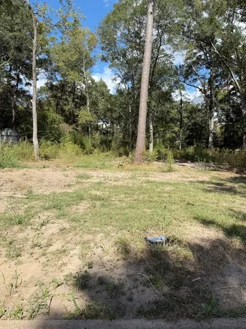 a fire hydrant in the middle of a field