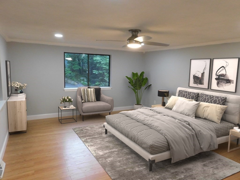 a spacious bedroom with a large bed and a couch