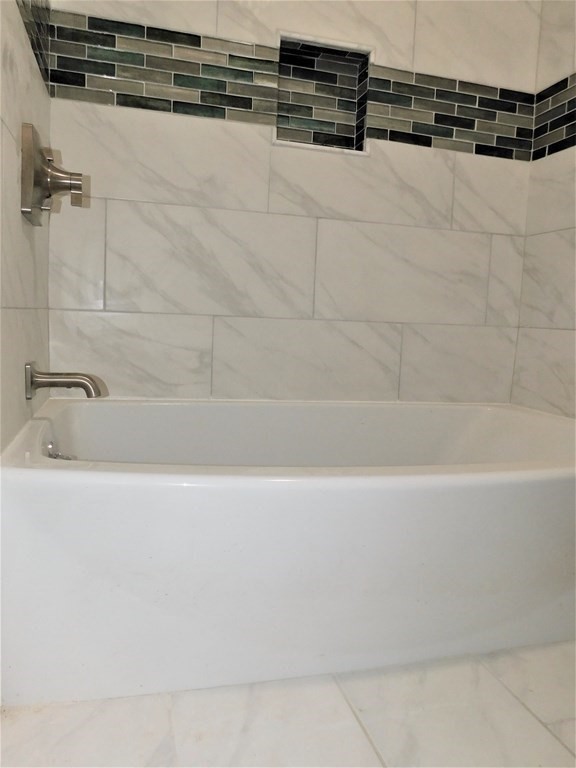 80 Mountain Gate Road, Unit 80 Ashland, MA 01721 - Photo 22 of 42 a bathroom with a bathtub