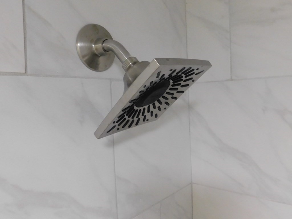 80 Mountain Gate Road, Unit 80 Ashland, MA 01721 - Photo 23 of 42 a close view of shoes in a white cabinet